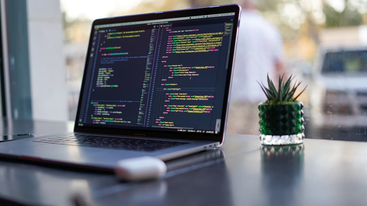 Programming code on screen representing software development with AI
