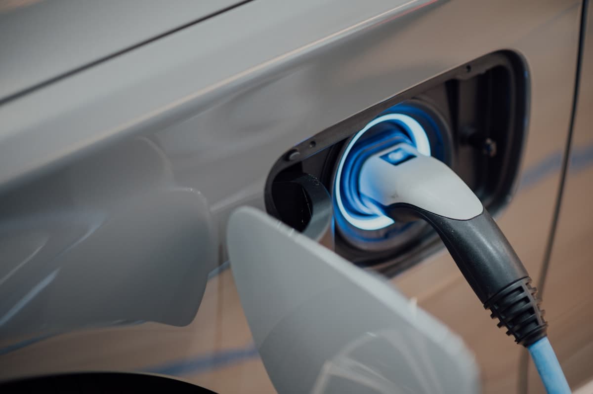 Electric car charging at modern charging station