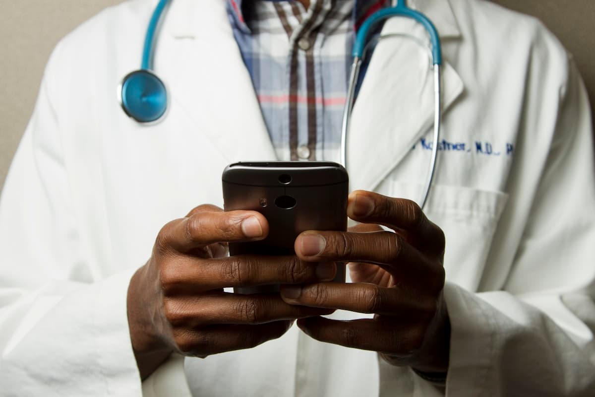 Doctor using tablet with artificial intelligence interface in hospital setting