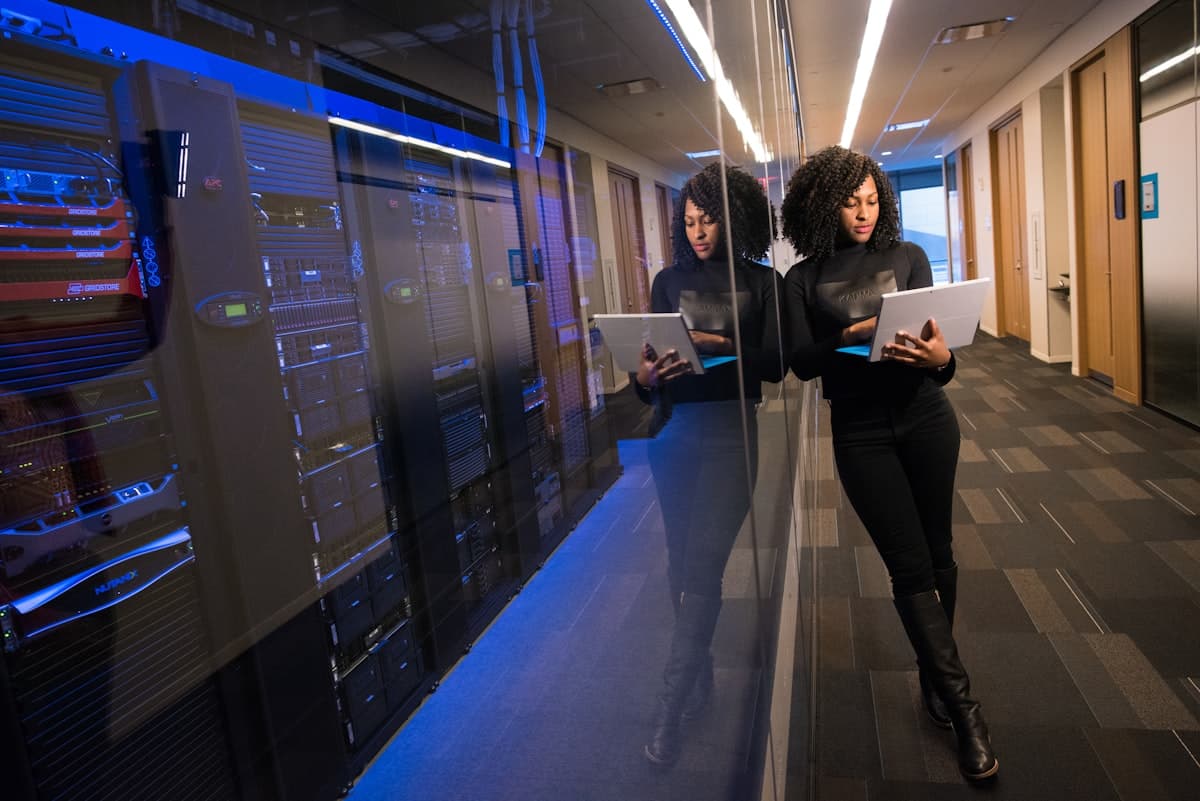 Professional woman using laptop representing AI-assisted web browsing