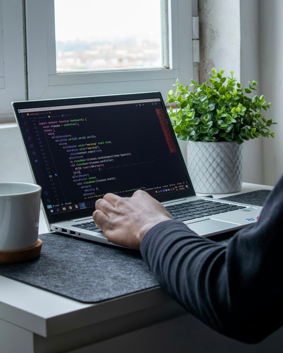 Software development interface with code and visual design