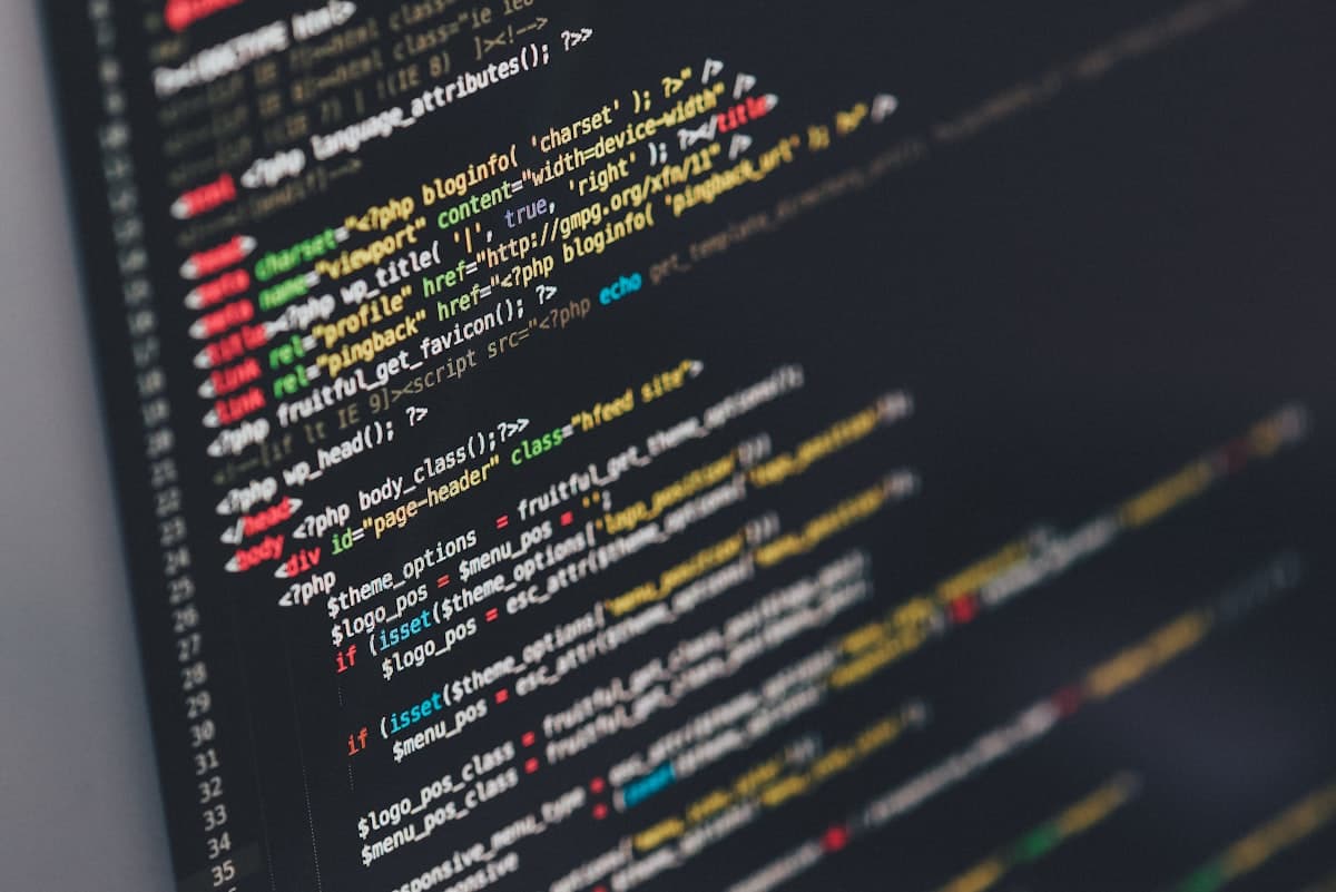 Computer screen displaying code lines representing Vibe Coding and AI-assisted development